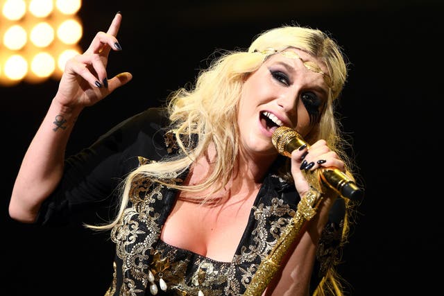Ke$ha has topped the UK singles chart with Pitbull shortly after checking into rehab for an eating disorder