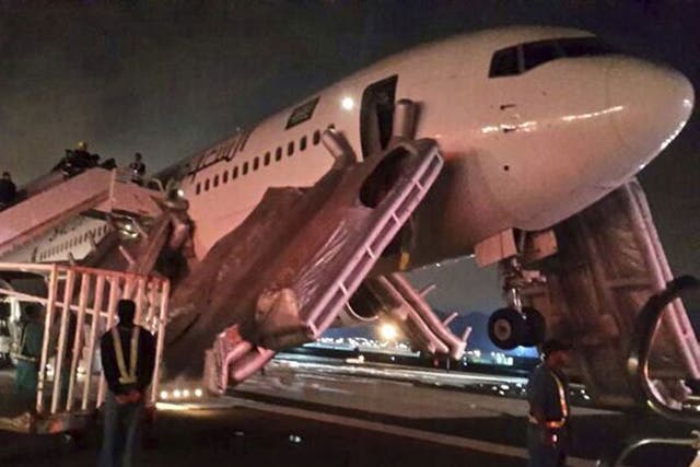 A Saudi Arabian Airlines plane after an emergency landing at Medina airport yesterday. Police were unable to confirm whether the incident was related to human remains that reportedly 'fell from the sky', also early on Sunday