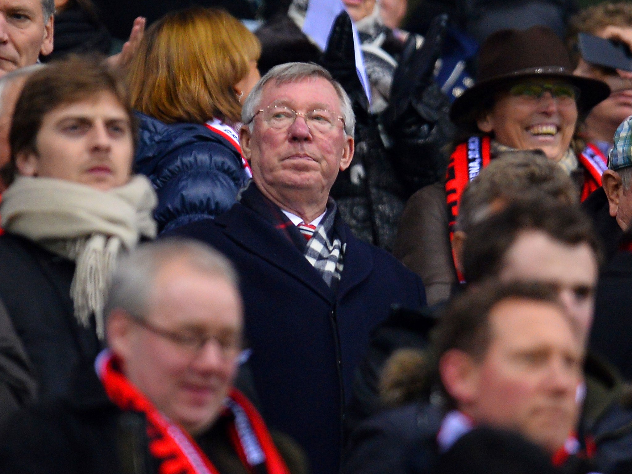 Sir Alex Ferguson observes from the stands as Manchester United play Bayer Leverkusen at the BayArena
