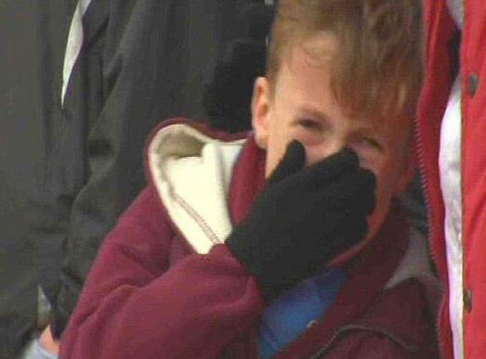 A young West Ham fans is pictured in tears during the club's 5-0 FA Cup defeat to Nottingham Forest