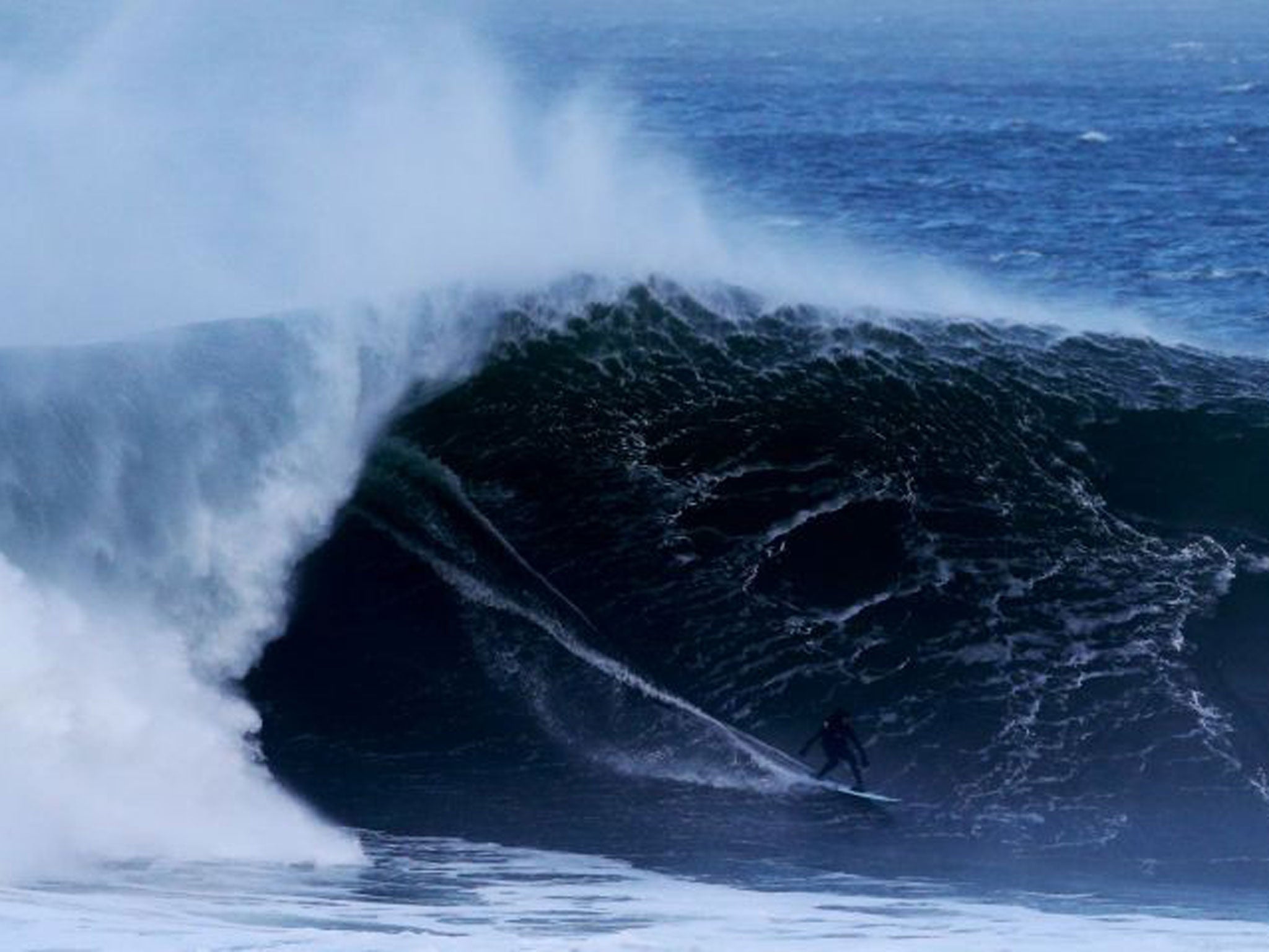 A surfer off the coast of Mullaghmore, County Sligo yesterday (Brian Lawless/PA)