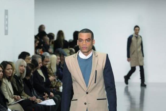  A model presents a creation from the Autumn/Winter 2014 Men's collection by British fashion designer Christopher Raeburn 