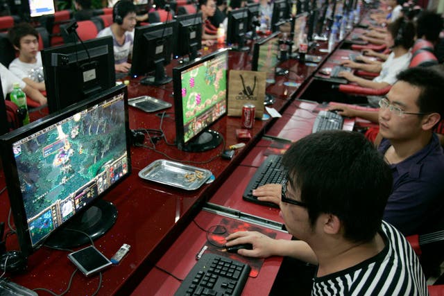 Customers play computer games at an Internet cafe in Taiyuan, Shanxi province, China.