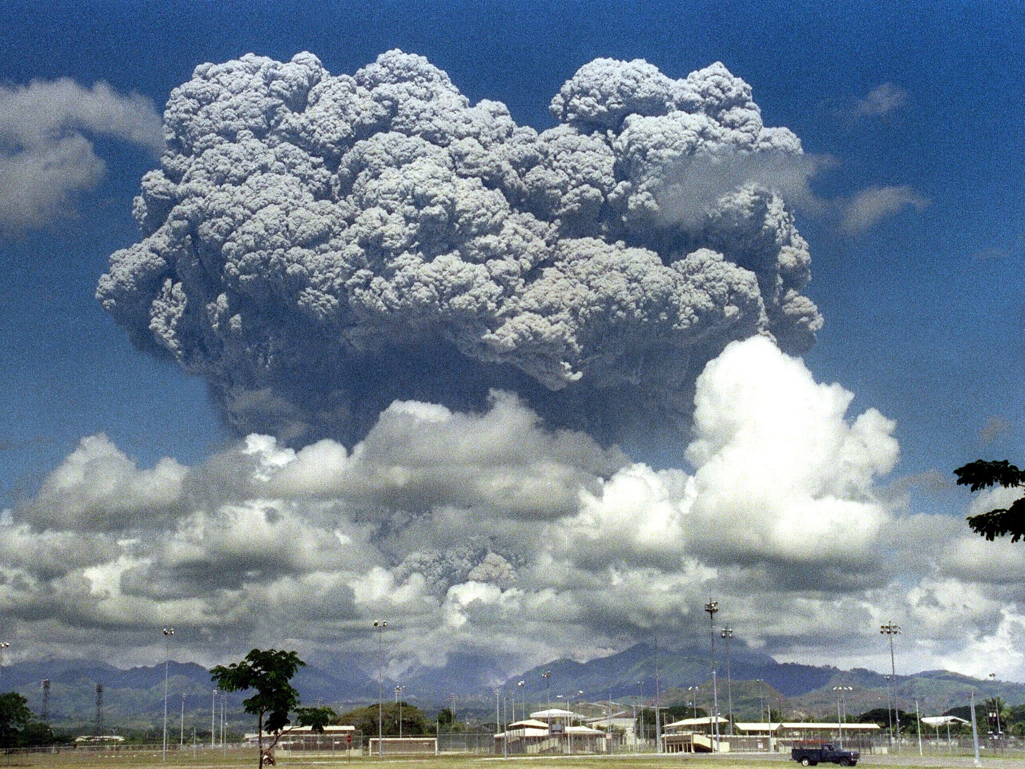 A giant cloud of volcanic debris rises some 20km above Mount Pinatubo in the Philippines in June 1991