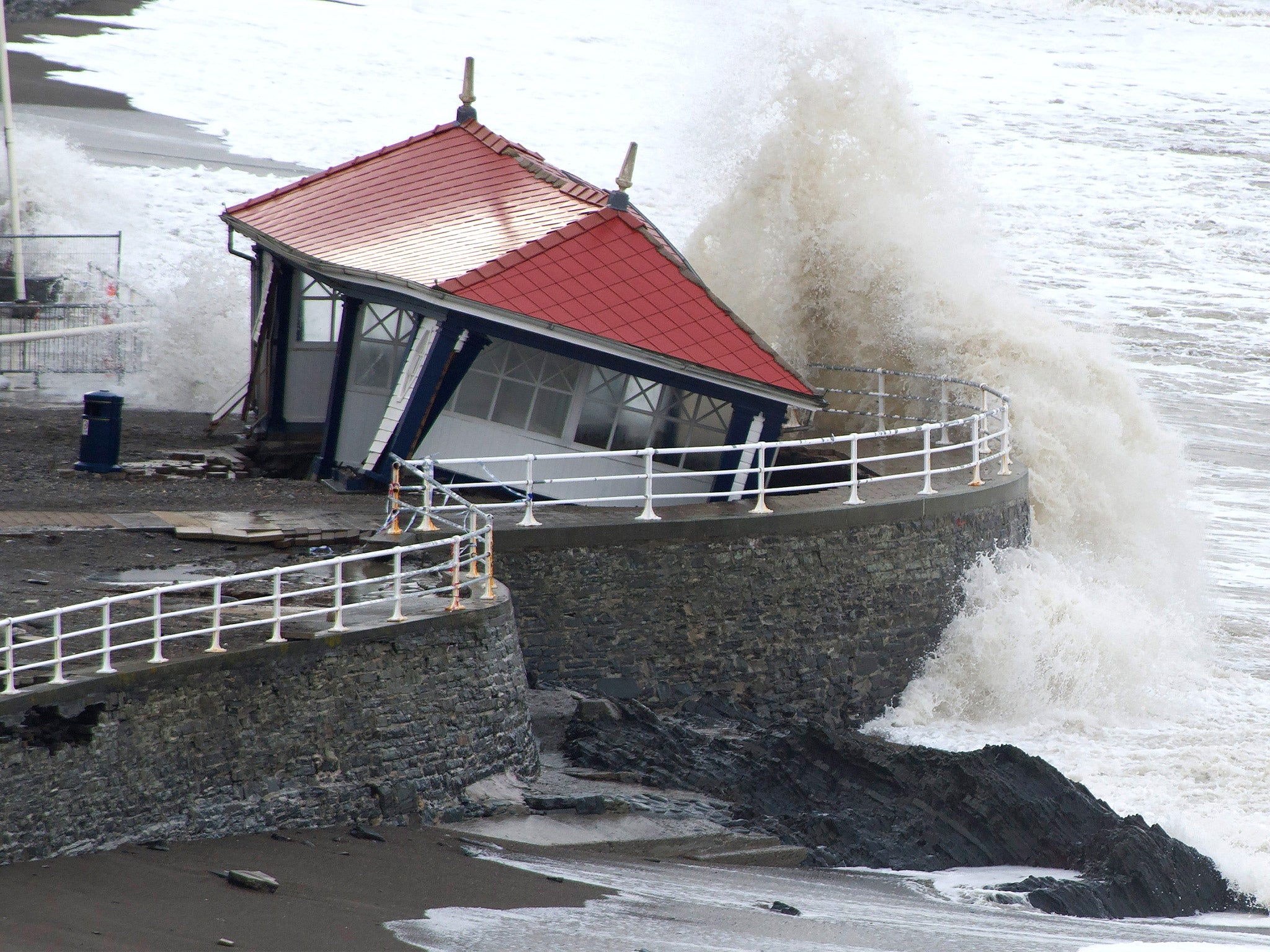 Waves ravage an already damaged Victorian promenade in Aberystwyth (Getty)
