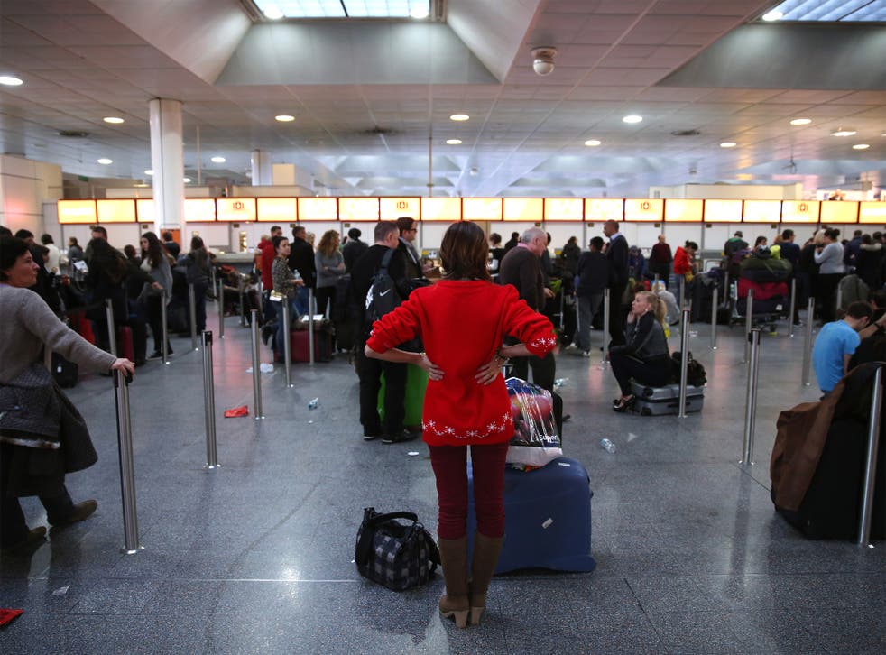 Frustrated passengers wait in the departure hall of Gatwick's North Terminal on Christmas Eve