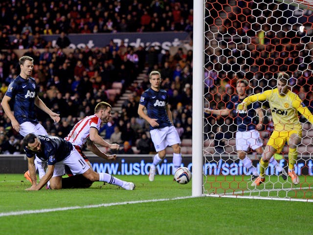 Ryan Giggs diverts the ball into his own net