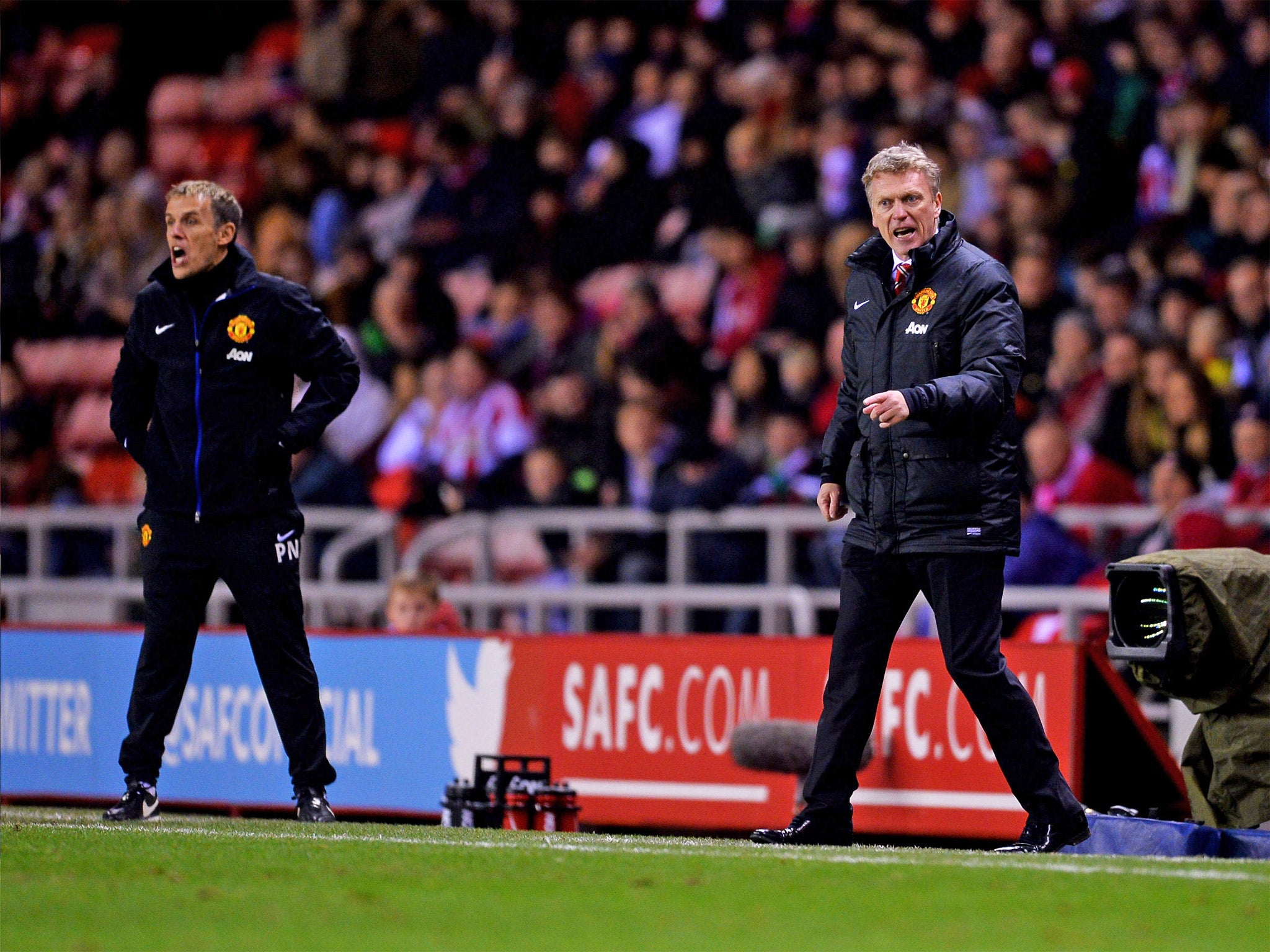 David Moyes and Phillip Neville bark instructions from the sideline