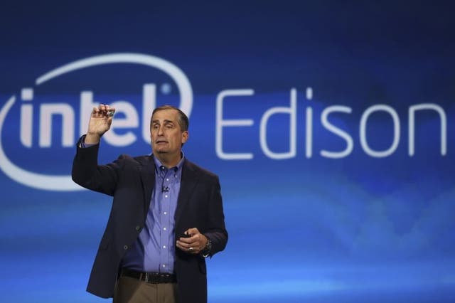 Intel CEO Brian Krzanich introduces Intel's Edison, a new personal computer the size of an SD card, during the annual Consumer Electronics Show (CES) in Las Vegas, Nevada January 6, 2014.