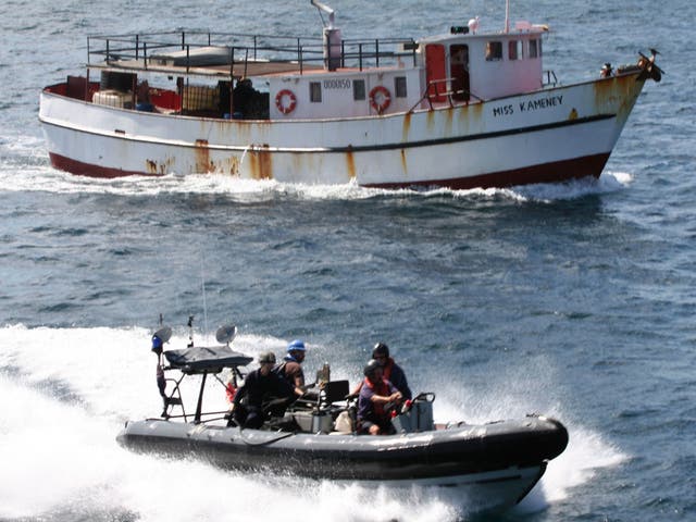 Personnel in a seaboat from RFA Wave Knight escort the suspected drug-carrying vessel