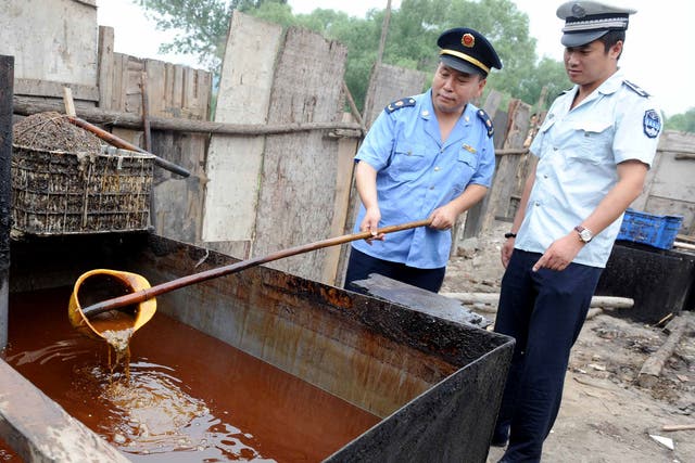 Crackdown: Chinese police inspect illegal cooking oil in 2010