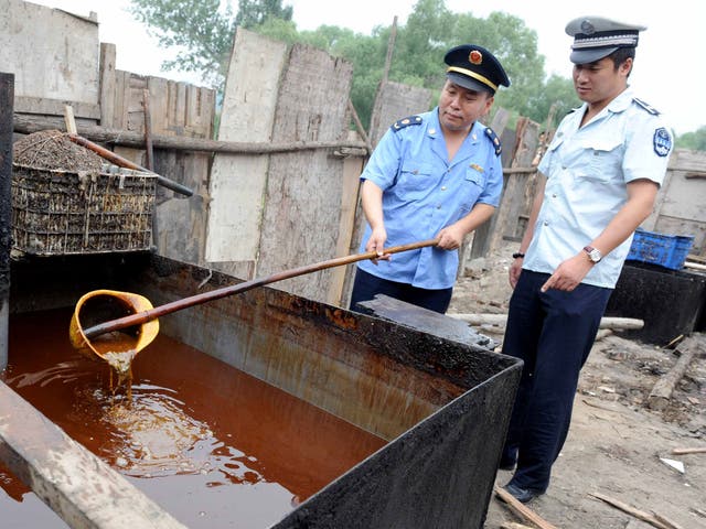 Crackdown: Chinese police inspect illegal cooking oil in 2010
