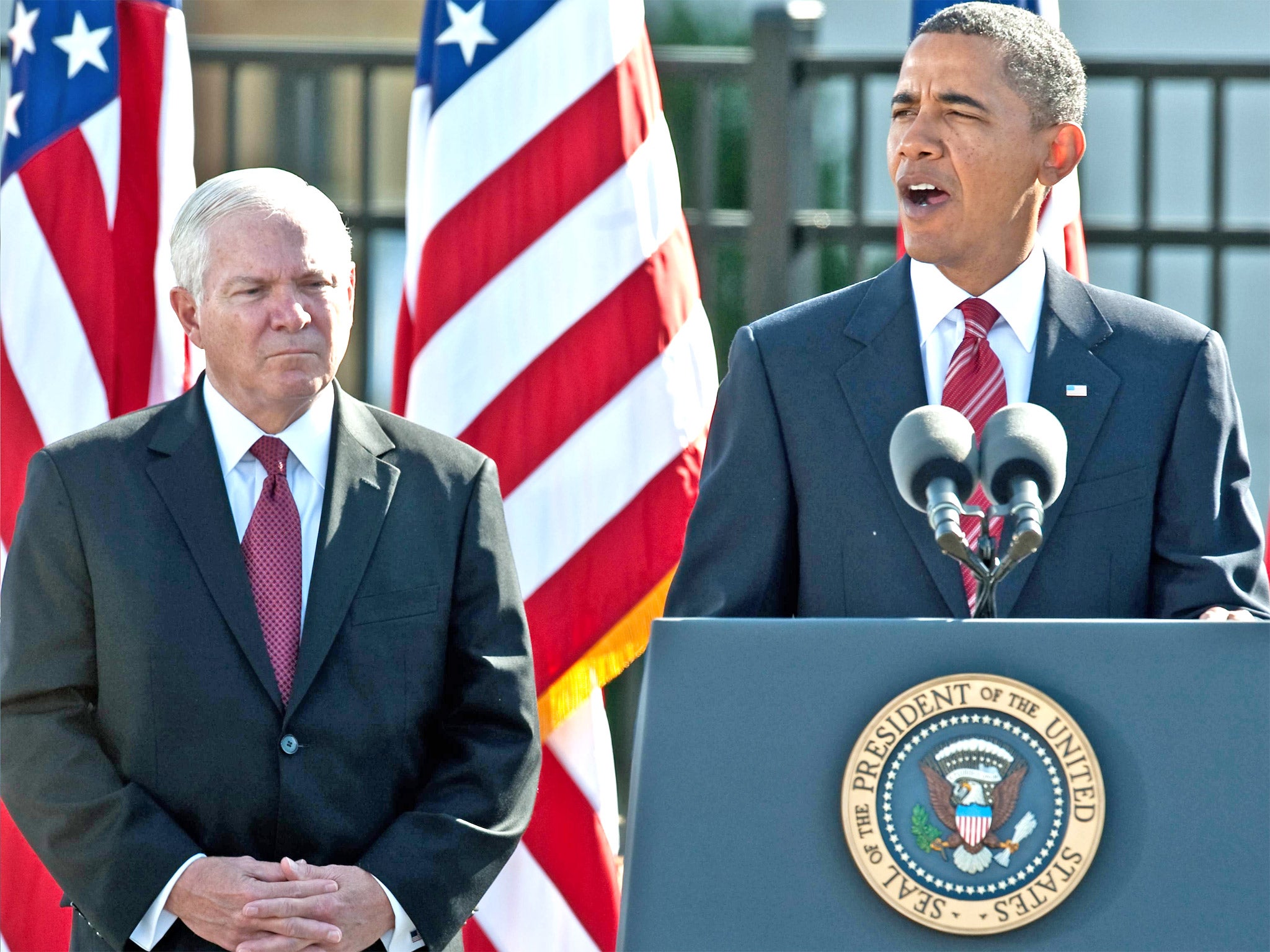 Barack Obama speaks, flanked by Defence Secretary Robert Gates, at a memorial service for the victims of the September 11 attacks on the Pentagon