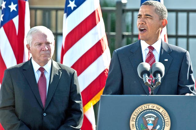 Barack Obama speaks, flanked by Defence Secretary Robert Gates, at a memorial service for the victims of the September 11 attacks on the Pentagon