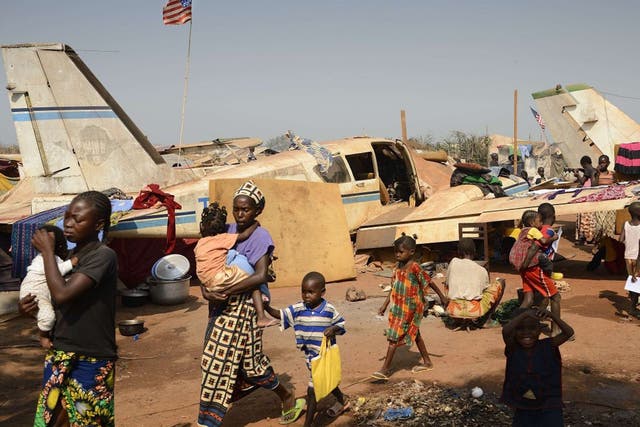Displaced people in an aero-club area near Mpoko Bangui airport where 100,000 people have fled