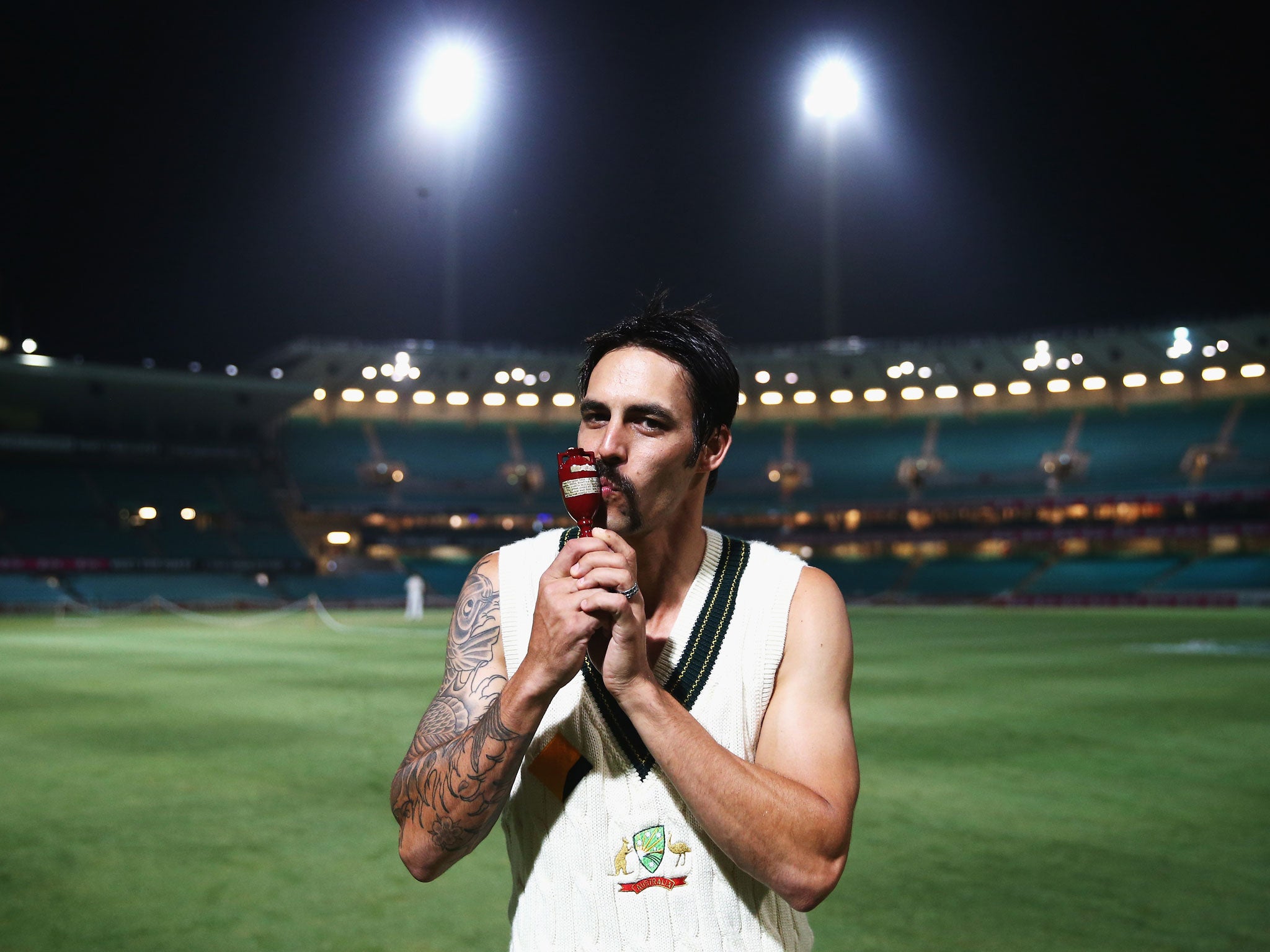 Mitchell Johnson celebrates with the Ashes Urn after the 5-0 whitewash over England