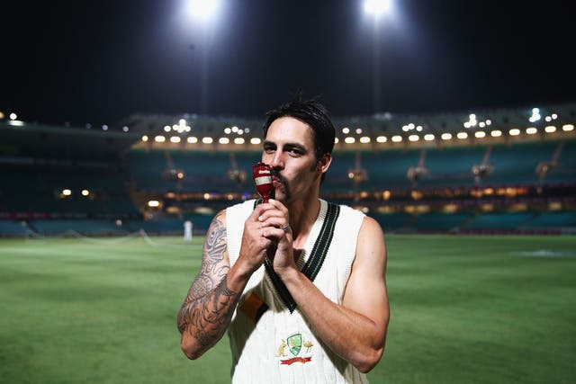 Mitchell Johnson celebrates with the Ashes Urn after the 5-0 whitewash over England