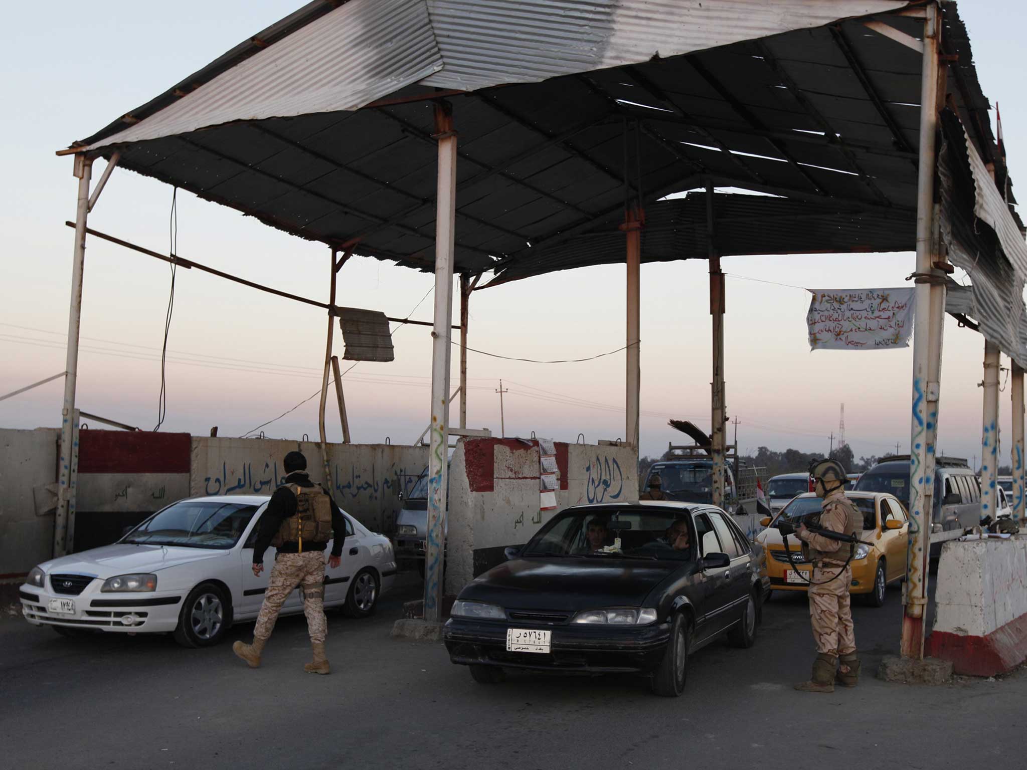 Iraqi soldiers search vehicles at a check point in the west of Baghdad as part of Prime Minister Nuri al-Maliki's campaign to eradicate al-Qa'ida