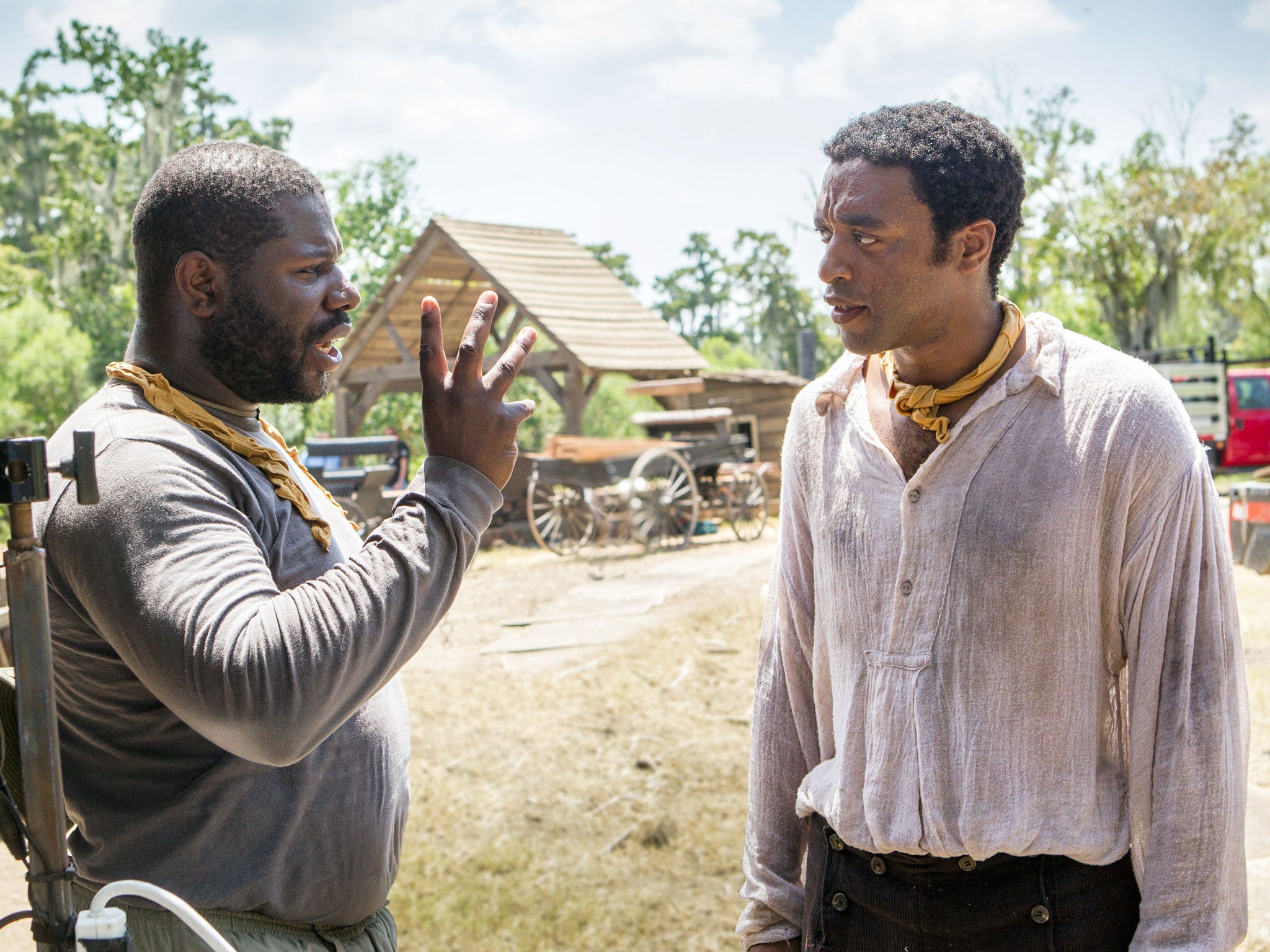 '12 Years a Slave'; director Steve McQueen and Chiwetel Ejiofor talk on set (Rex)