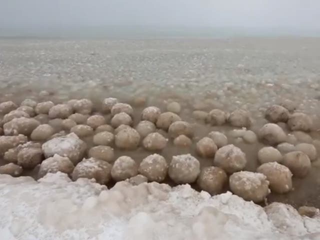 Ice balls washing up on the shores of Lake Michigan as the US is plunged into sub zero temperatures