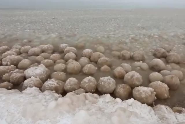 Ice balls washing up on the shores of Lake Michigan as the US is plunged into sub zero temperatures