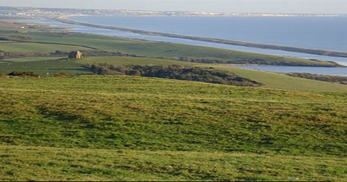 Visit-Dorset - A fantastic shot over Chesil Beach and the Fleet Nature  Reserve. 💦⁠ Chesil beach is a bank of pebbles stretching for 18 miles  along the Dorset Coast. Trapped behind this