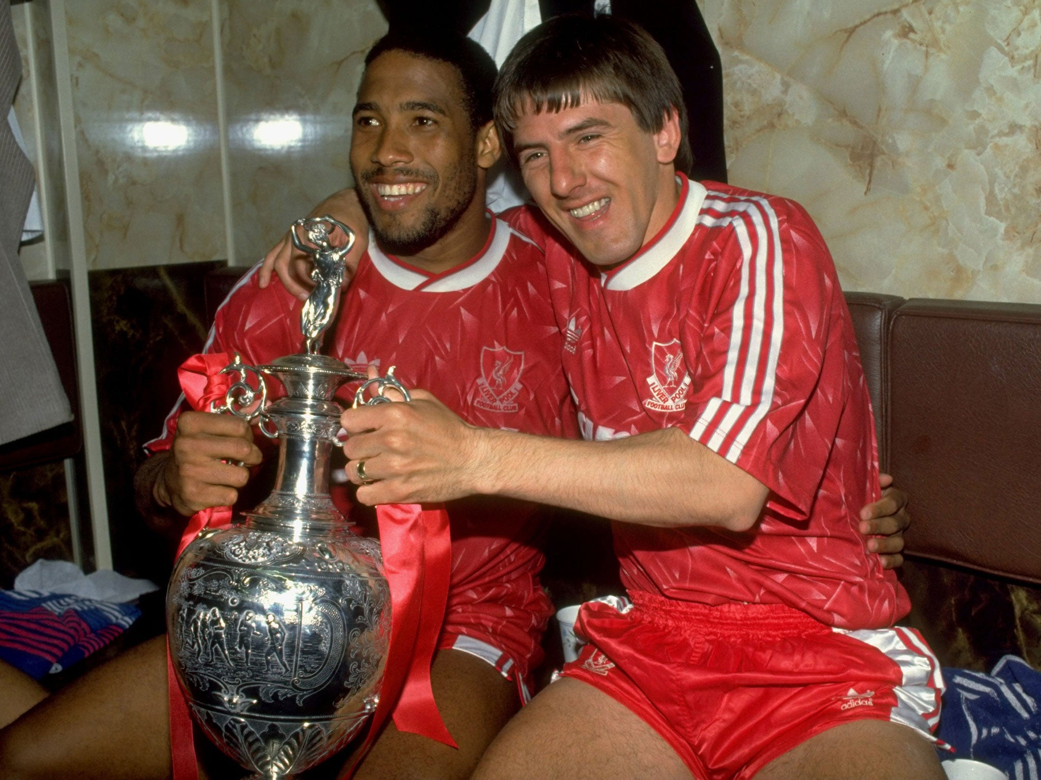 John Barnes (left) and Peter Beardsley celebrate Liverpool's last title – back in 1990