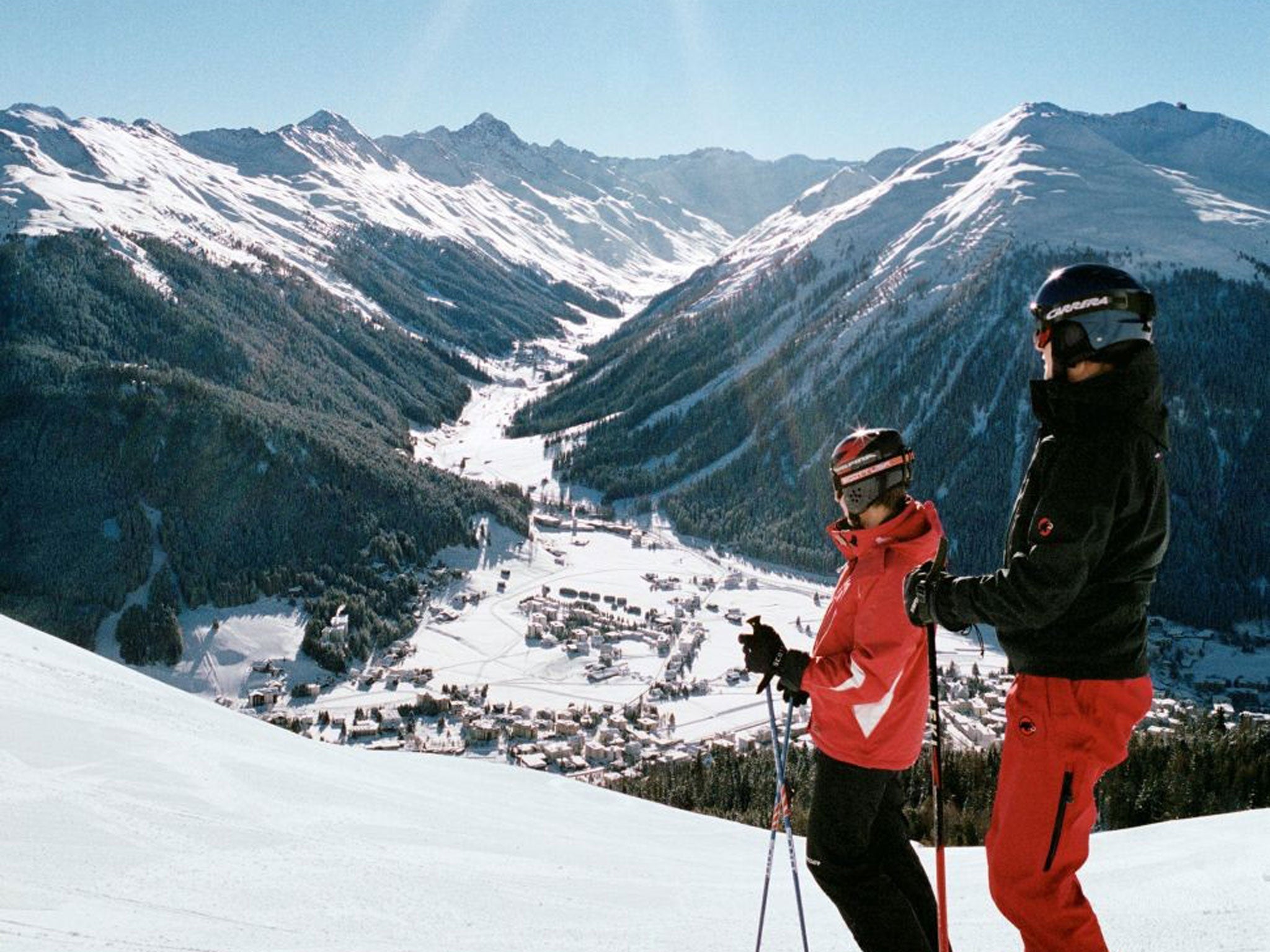 High society: Skiers looking down to the Swiss resort of Klosters