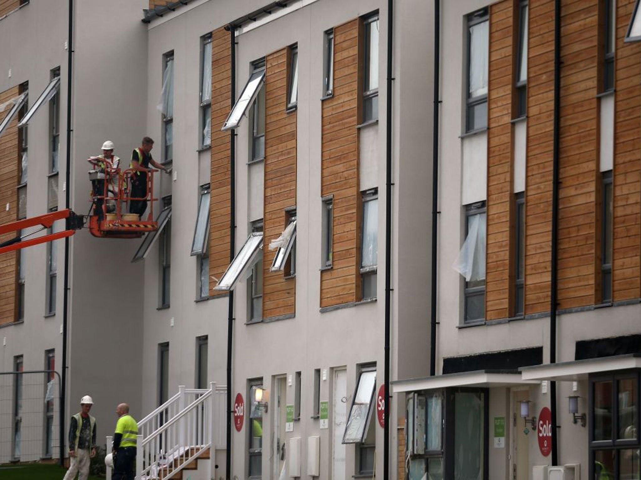 Construction workers building new homes at a housing development in Filton, Bristol
