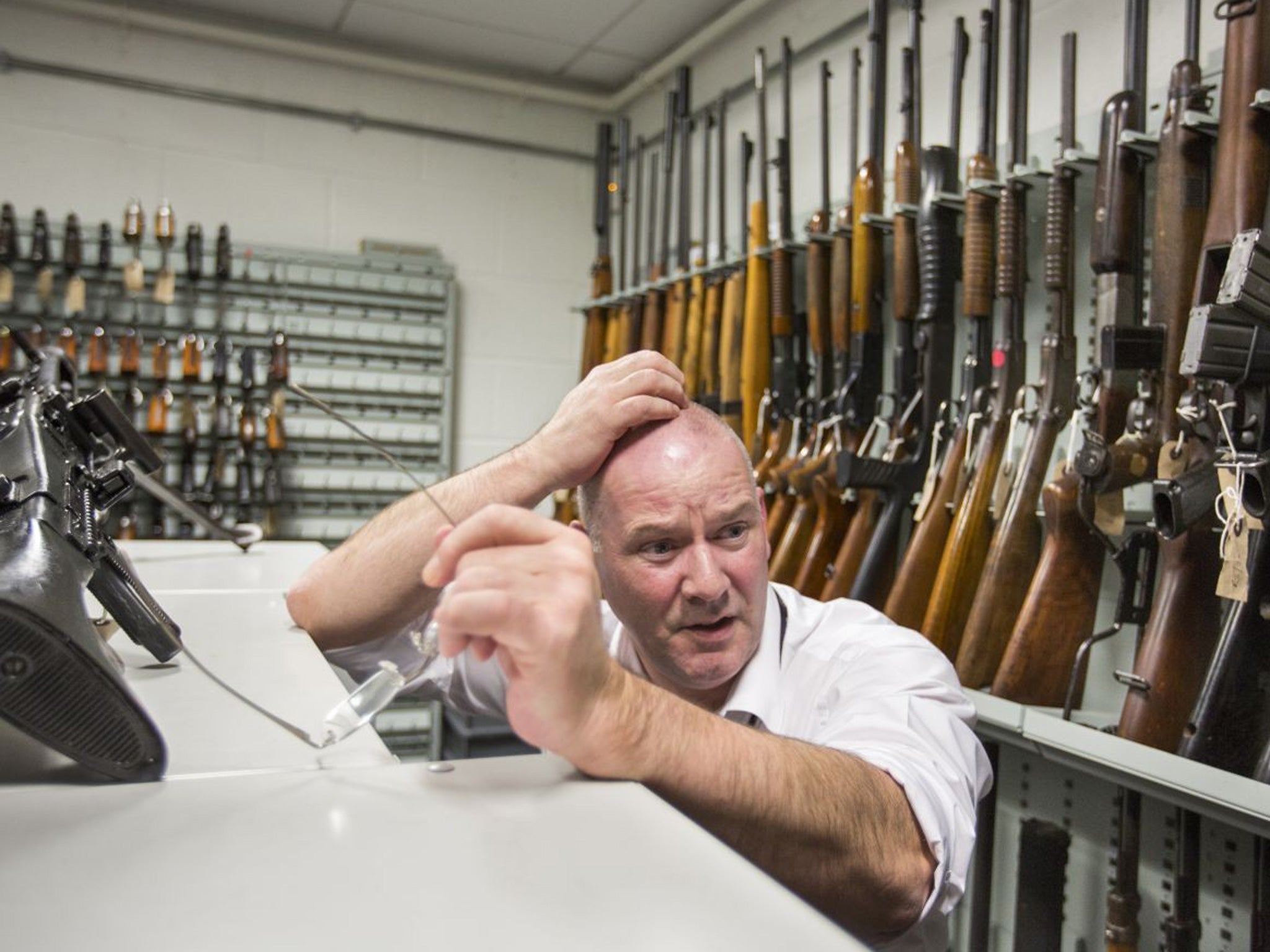 Tony Gallagher, a ballistics expert, in the armoury at the National Ballistics Intelligence Service in Birmingham