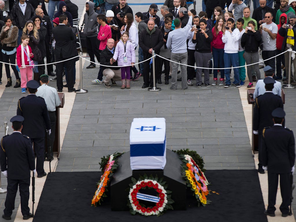 People gather as former Israeli Prime Minister Ariel Sharon lies in state at Knesset Plaza on January 12, 2014 in Jerusalem, Israel.