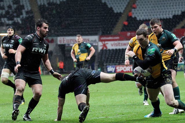 George North of Northampton brushes off the challenge  of Ospreys’ Jeff Hassler