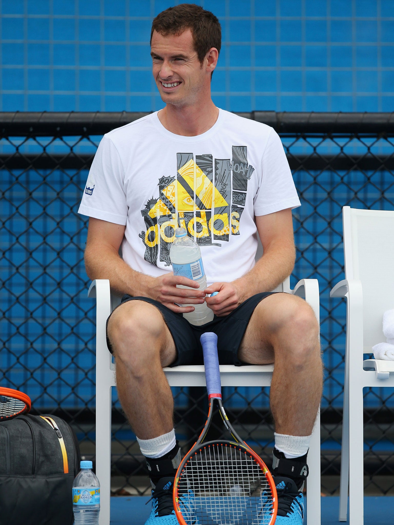 Andy Murray takes a much-needed drinks break during training at Melbourne Park