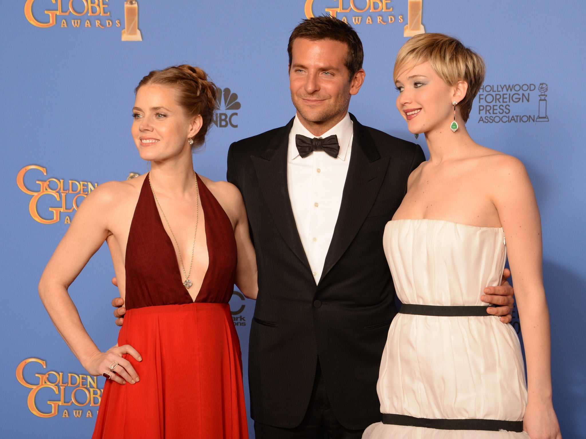 American Hustle actors Amy Adams, Bradley Cooper and Jennifer Lawrence. The film won best motion picture (comedy or musical)