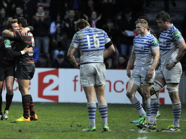 Alex Goode, Chris Ashton and Ernst Joubert of Saracens look dejected after defeat to Toulouse