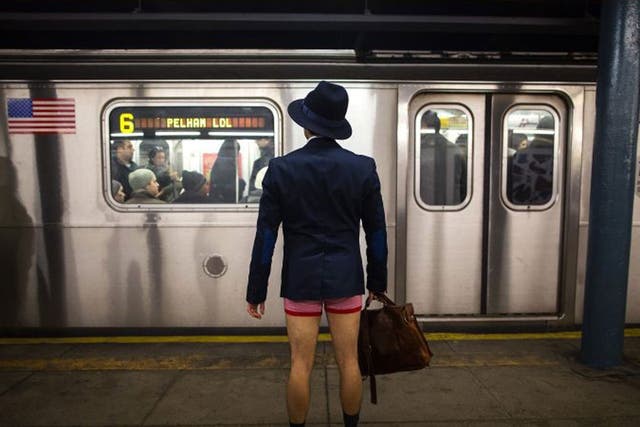 A man takes part in the annual No Pants Subway Ride in New York 12 January 2014