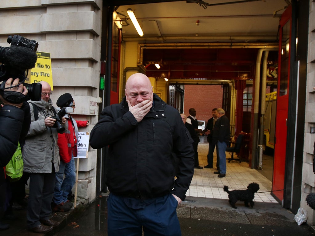 ireman Alex Badcock is overcome with emotion as he walks out of Clerkenwell fire station after completing the last ever shift there on January 9, 2014 in London, England. At 100 years old Clerkenwell is the oldest fire station in the country. It is closin
