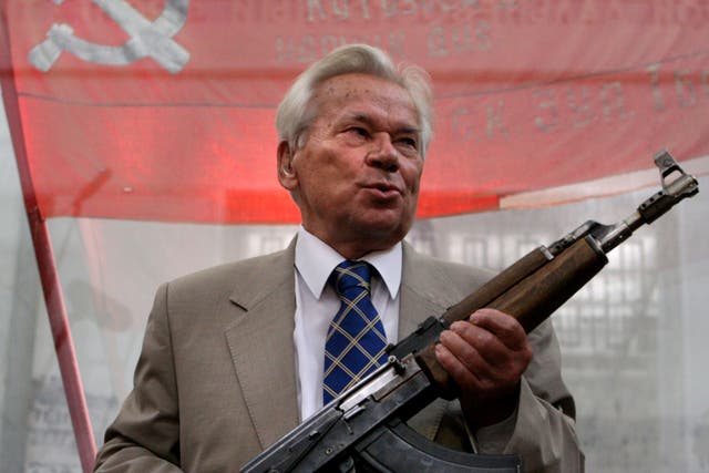 Mikhail Kalashnikov posing with the first model of his legendary AK-47 - he died on 23 December, 2013 at the age of 94