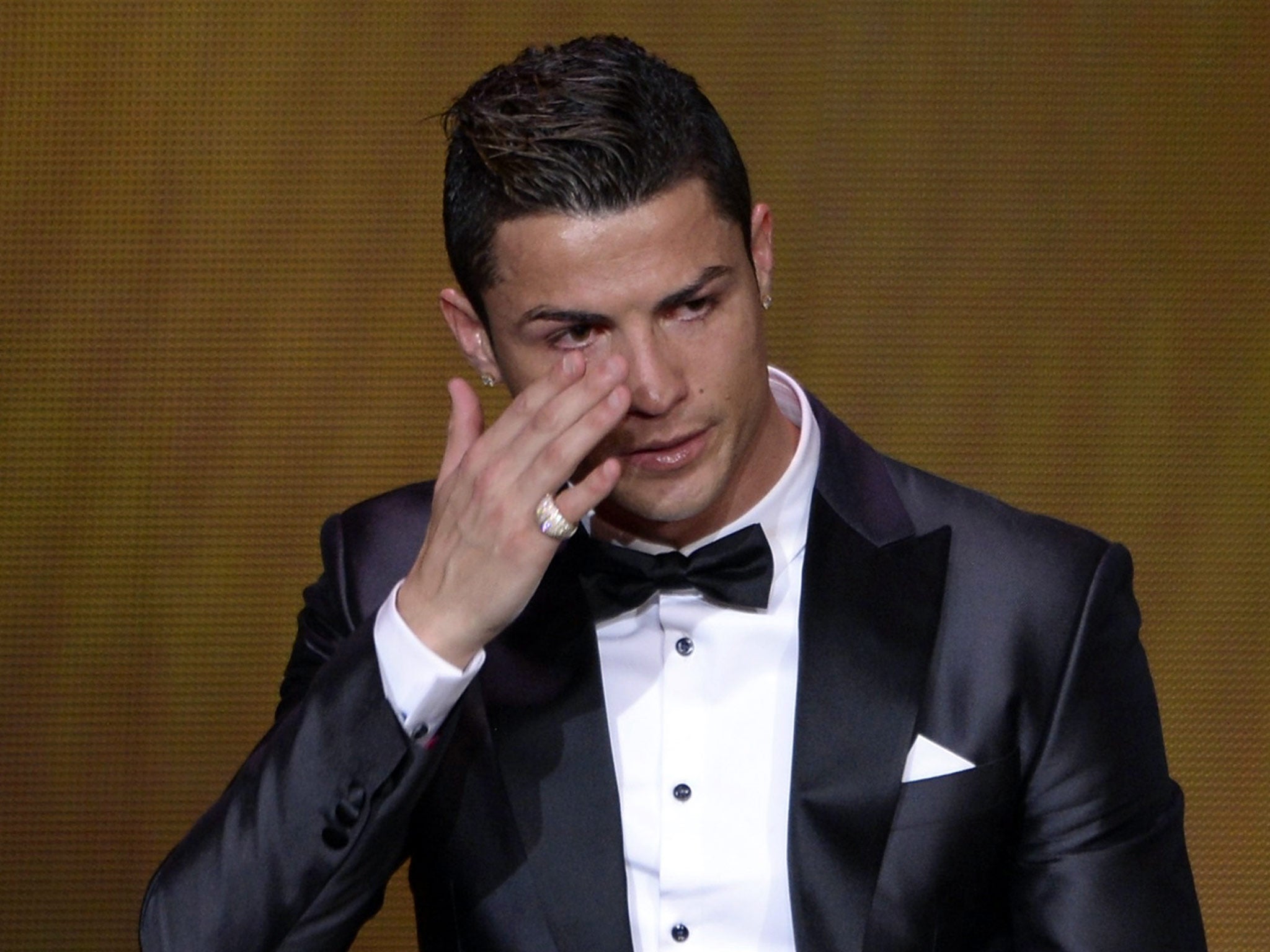 Cristiano Ronaldo fights back tears after winning the Fifa Ballon d'Or award