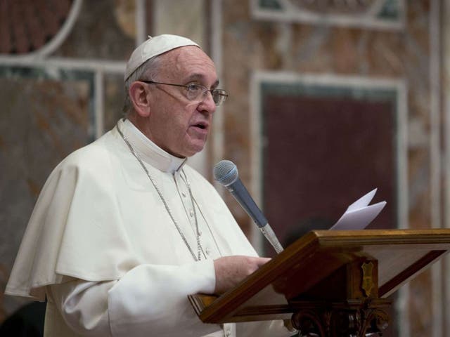 Pope Francis addresses ambassadors to the Holy See at the Vatican on January 13, 2014