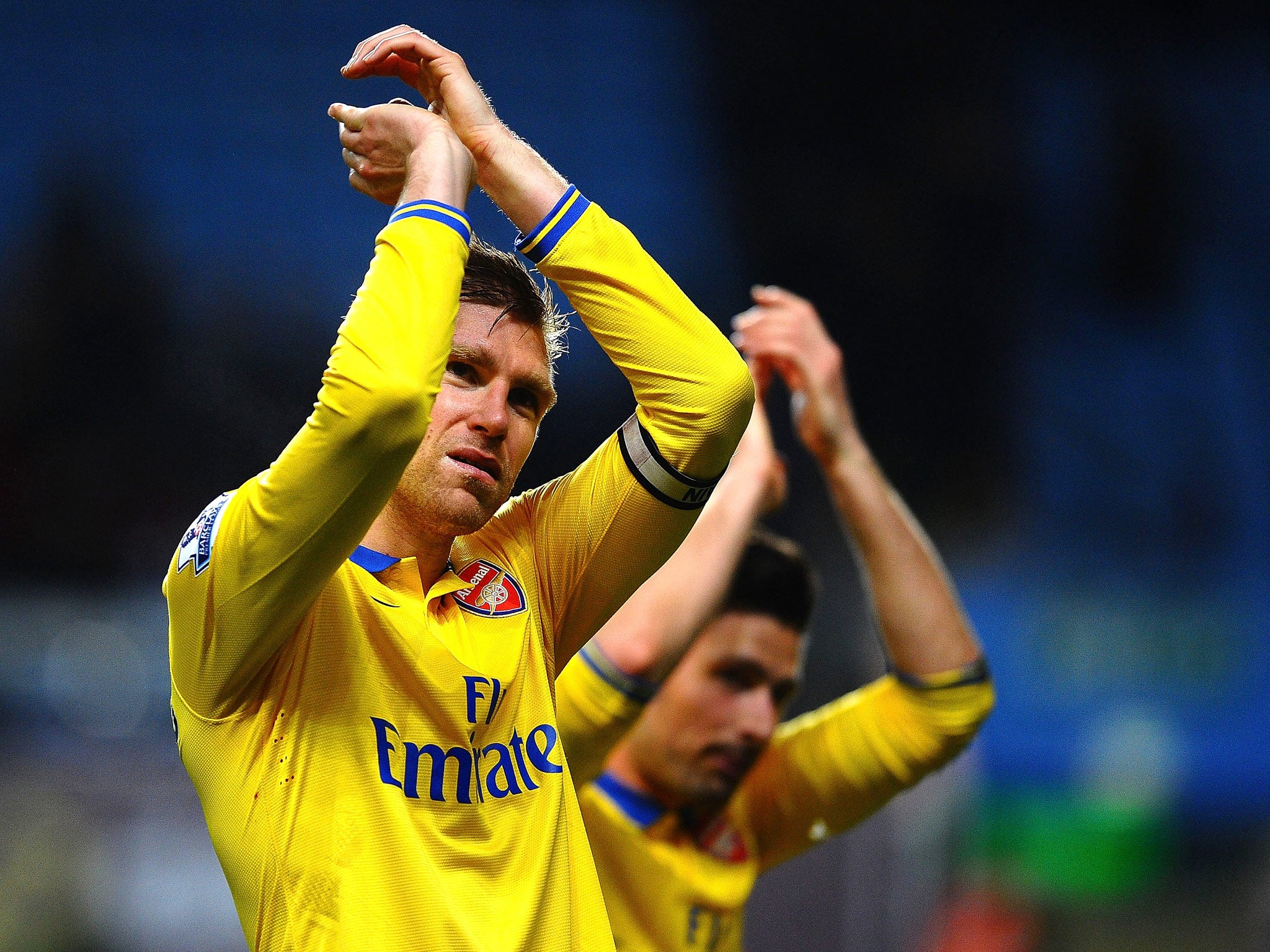 Per Mertesacker celebrates after Arsenal's victory over Aston Villa