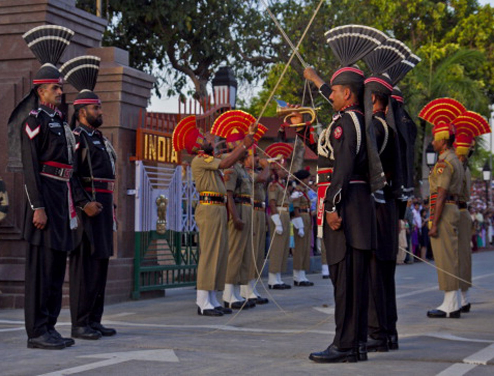 Guards march in parallel lines at the border separating Pakistan and India.