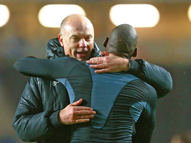 Wigan manager Uwe Rosler celebrates with Marc-Antoine Fortune of Wigan following their team's 3-1 victory over MK Dons