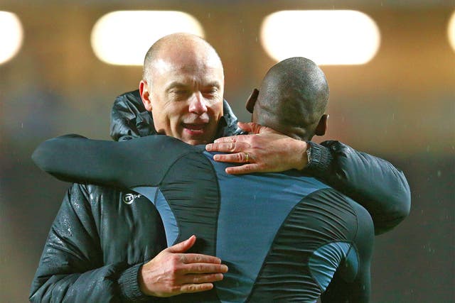 Wigan manager Uwe Rosler celebrates with Marc-Antoine Fortune of Wigan following their team's 3-1 victory over MK Dons