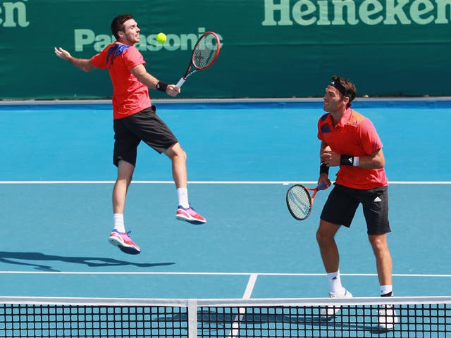 Ross Hutchins (R) and Colin Fleming (L) progressed to the second round of the Australian Open on the former's return to Grand Slam action after his battle with cancer