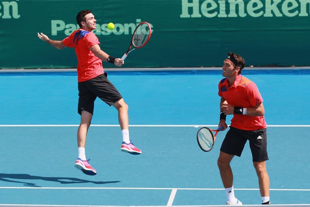 Ross Hutchins (R) and Colin Fleming (L) progressed to the second round of the Australian Open on the former's return to Grand Slam action after his battle with cancer