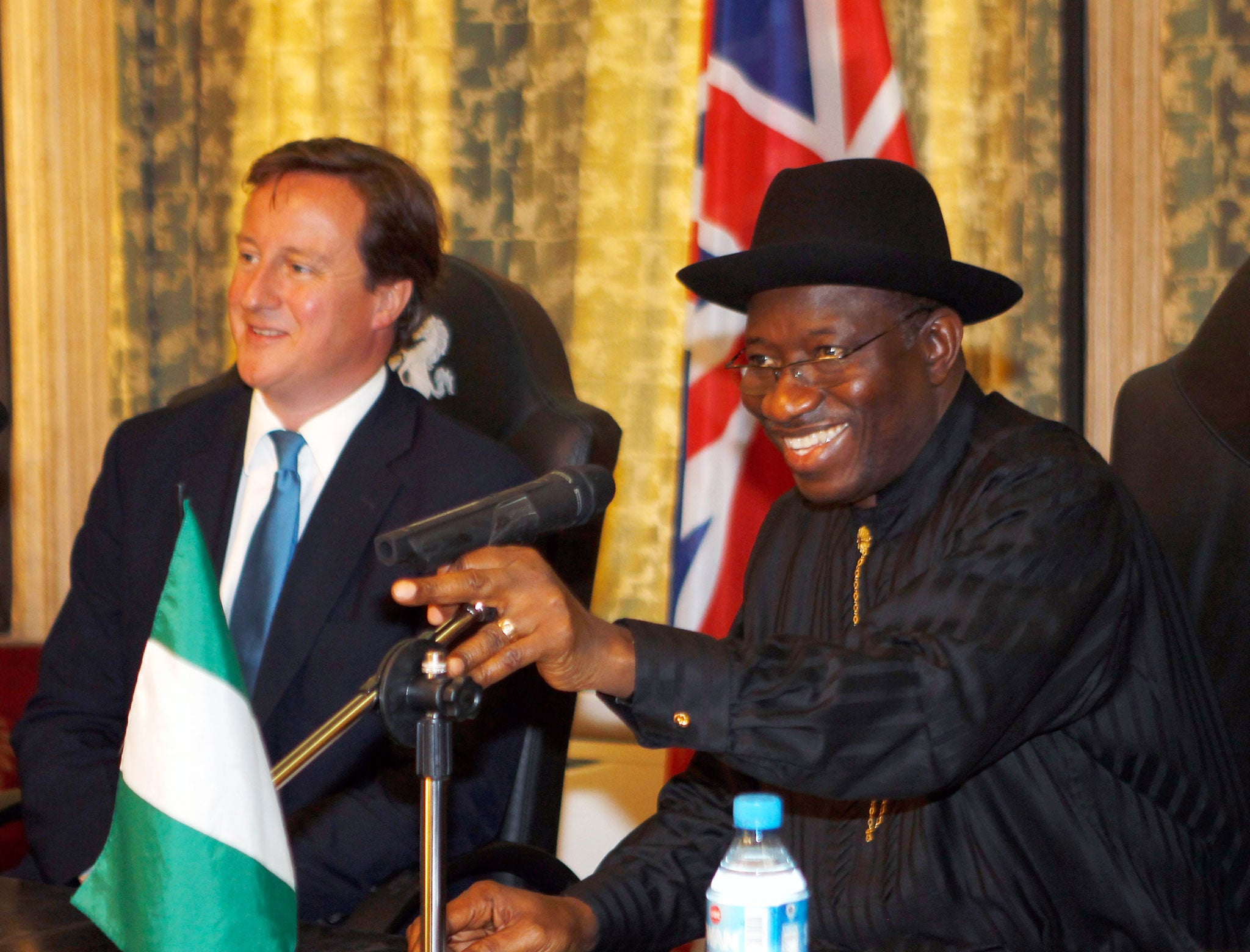 British Prime Minister David Cameron and Nigerian President Goodluck Jonathan take part in round table talks in Nigeria during July 2011