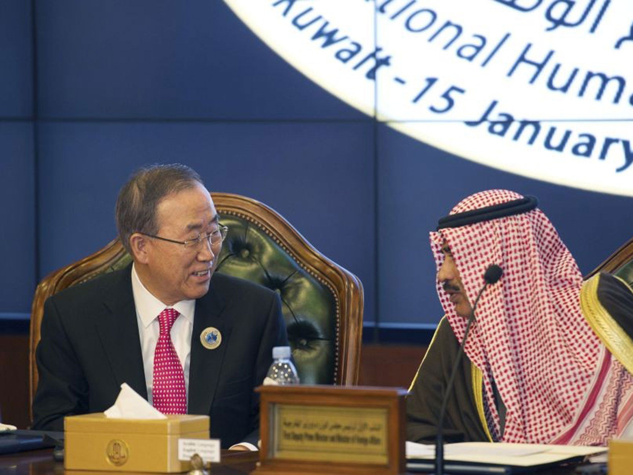 United Nations Secretary General Ban Ki-Moon talks to Kuwait's Minister of Foreign Affairs Sheikh Sabah alKhalid AlSabah at the end of the Second International Humanitarian Pledging Conference for Syria at Bayan Palace in Kuwait January 15, 2014