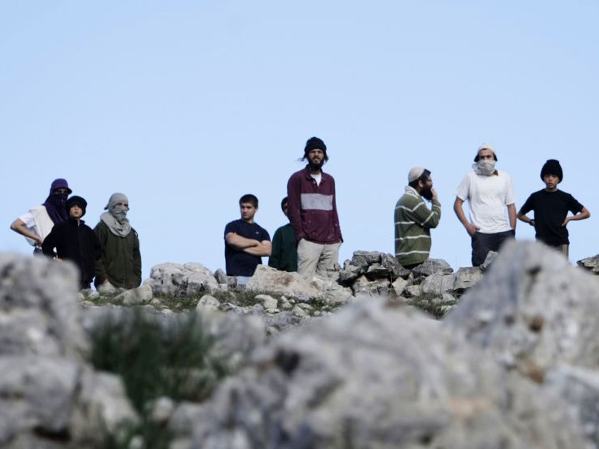 Israeli settlers of Yitzhar confront Palestinians in Burin village in the West Bank