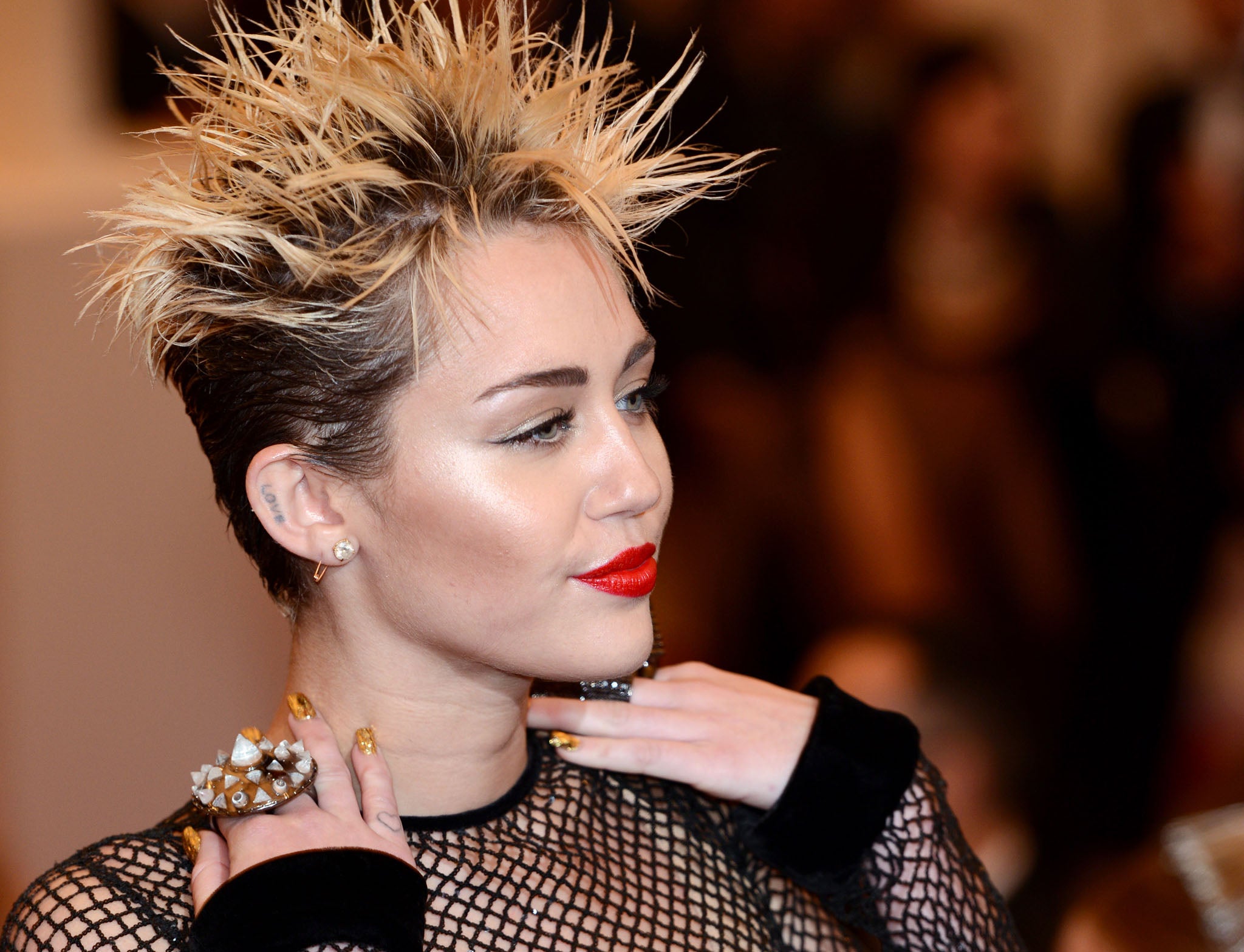 Braless Miley Cyrus flashes her nipples in completely see-through